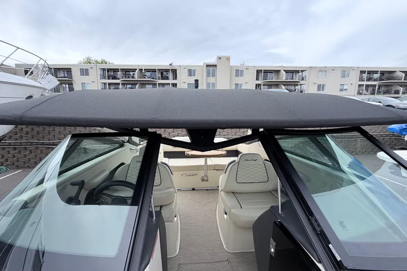Slide: The Image of 2026 Chris-Craft Sportster 25 boat interior with sleek design and comfortable seating. - 44