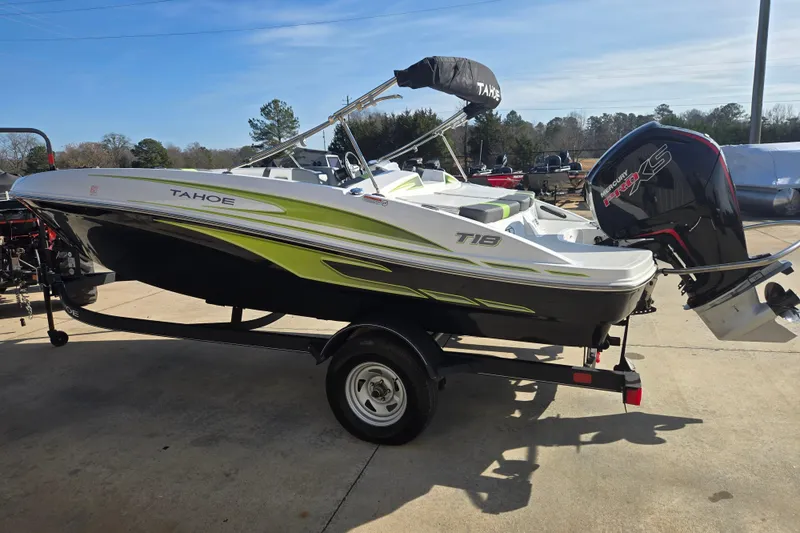 Slide: The Image of 2023 Tahoe T18 boat with trailer, featuring sleek design and powerful Mercury engine. - 3