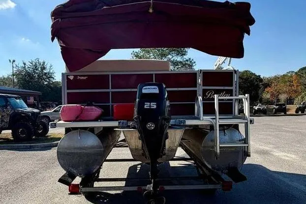 Slide: The Image of 2017 Bentley Pontoons 140 Cruise with Mercury 25 engine, parked outdoors. - 6