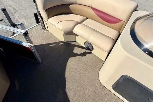 Slide: The Image of 2017 Bentley Pontoons 140 Cruise interior with beige seating and red accents. - 8