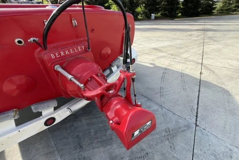 Slide: The Image of Red 1975 Weirdt Maverick boat with Berkeley jet drive on concrete surface. - 16