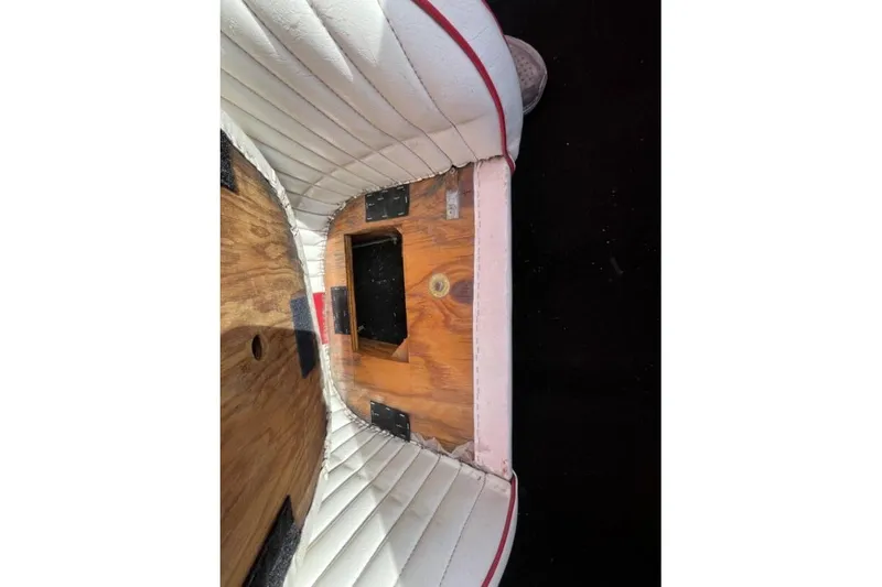 Slide: The Image of Interior of a 1975 Weirdt Maverick with white and red upholstery. - 30
