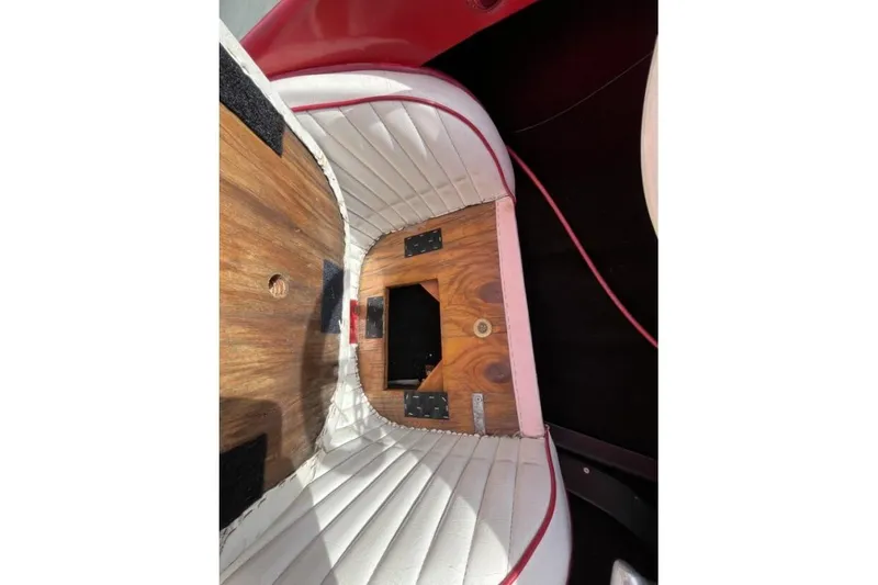 Slide: The Image of Interior of a 1975 Weirdt Maverick with wood paneling and white upholstery. - 31