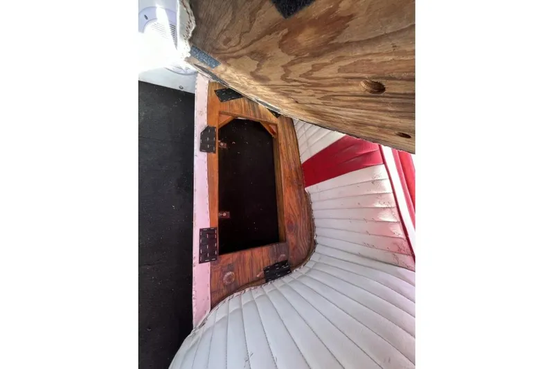 Slide: The Image of Interior of a 1975 Weirdt Maverick with wooden and red-white upholstery details. - 32