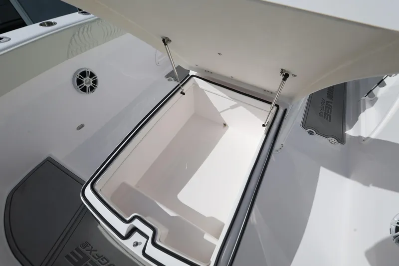 Slide: The Image of Open storage compartment on 2025 Twin Vee 280 GFX2 CC boat. - 12