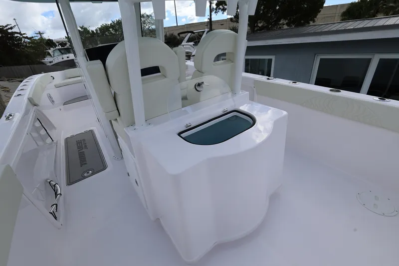 Slide: The Image of 2025 Twin Vee 280 GFX2 CC boat interior with seating and storage compartments. - 21