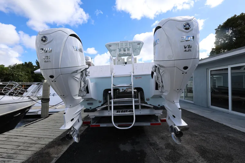 Slide: The Image of 2025 Twin Vee 280 GFX2 CC boat with dual Yamaha 300 V6 engines at dock. - 5