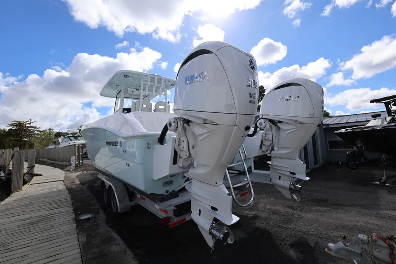 Slide: The Image of 2025 Twin Vee 280 GFX2 CC boat with dual Yamaha outboard engines on a trailer. - 6