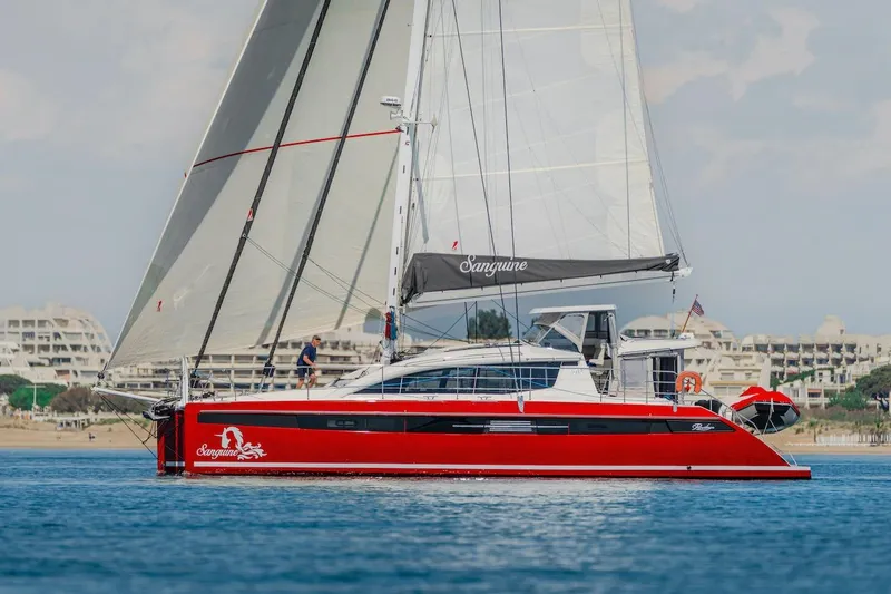 Slide: The Image of Red Privilege Signature 510 yacht sailing on calm waters, year 2025. - 6