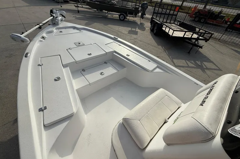 Slide: The Image of 2017 Blazer Bay 2200 boat interior with seating and storage compartments. - 10