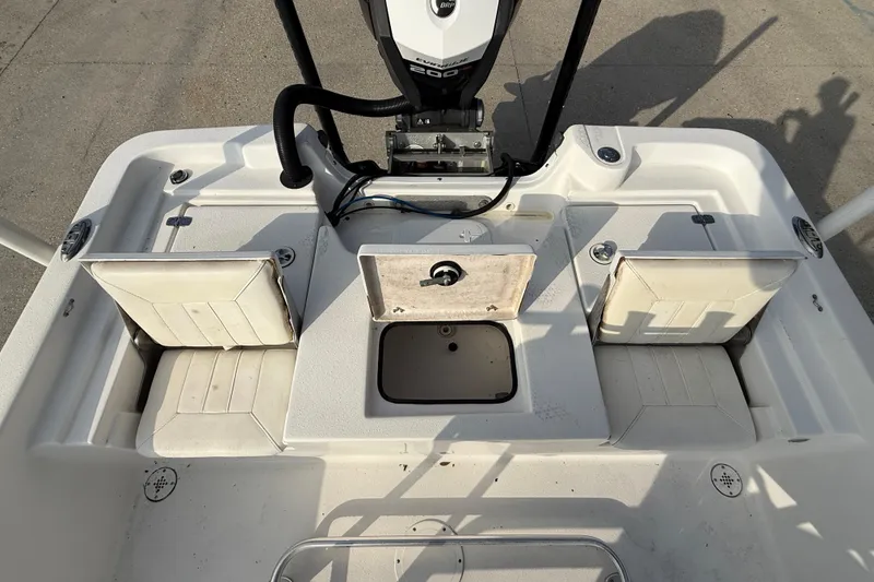 Slide: The Image of 2017 Blazer Bay 2200 boat interior with seating and storage compartments. - 14