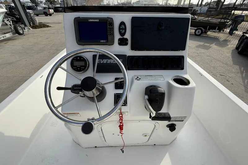 Slide: The Image of 2017 Blazer Bay 2200 boat console with steering wheel and navigation equipment. - 15