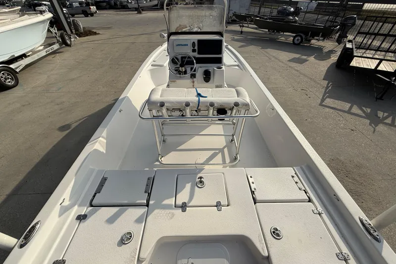 Slide: The Image of 2017 Blazer Bay 2200 boat interior with steering console and seating. - 8