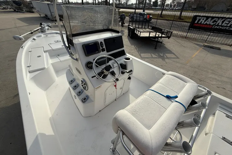 Slide: The Image of 2017 Blazer Bay 2200 boat interior with steering console and seating. - 9