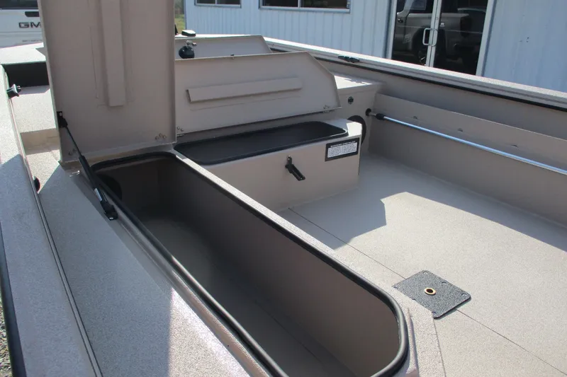 Slide: The Image of 2026 Avid 18 Commander boat interior with open storage compartments. - 10