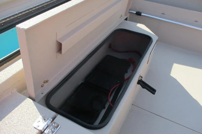 Slide: The Image of Open storage compartment in 2026 Avid 18 Commander boat. - 11