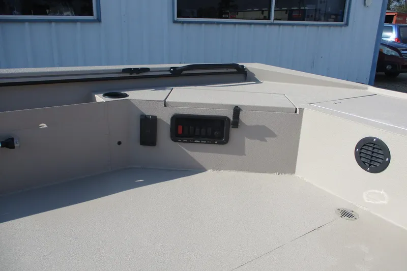 Slide: The Image of Interior view of 2026 Avid 18 Commander boat, featuring control panel and speaker. - 13