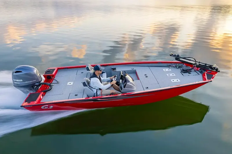 Slide: The Image of 2026 G3 Sportsman 1810 PFX boat displayed in a marine sales showroom. - 1