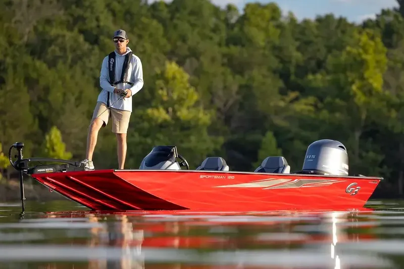 Slide: The Image of 2026 G3 Sportsman 1810 PFX boat dashboard with steering wheel and control panel. - 2