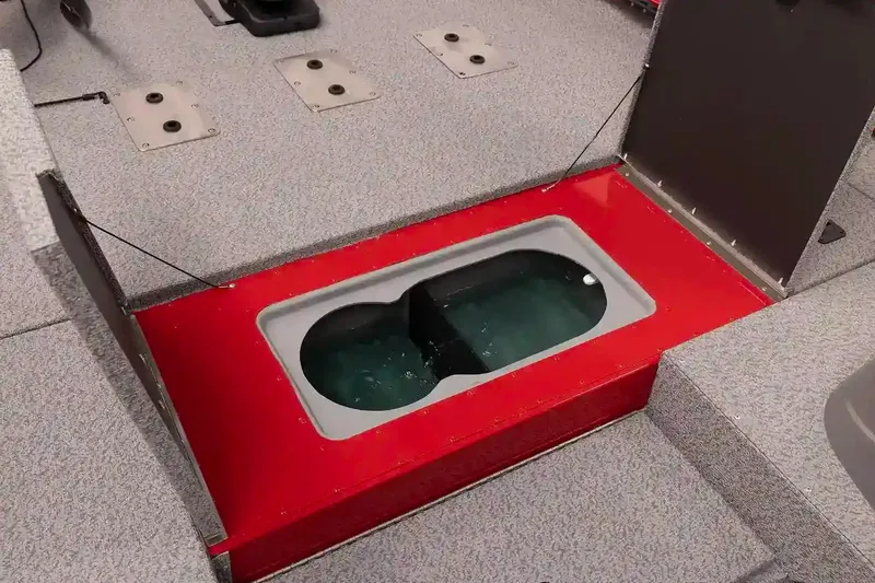 Slide: The Image of 2026 G3 Sportsman 1810 PFX boat interior with gray seating and spacious layout. - 3