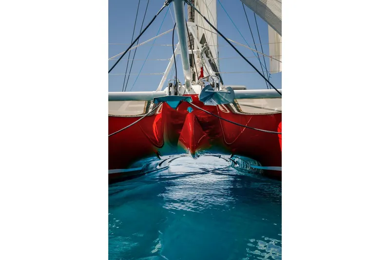 Slide: The Image of Red Privilege Signature 510 catamaran on blue water, 2025 model. - 66