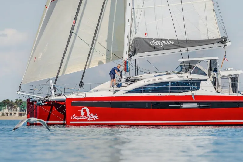 Slide: The Image of Red Privilege Signature 510 yacht sailing on calm waters, 2025 model. - 69