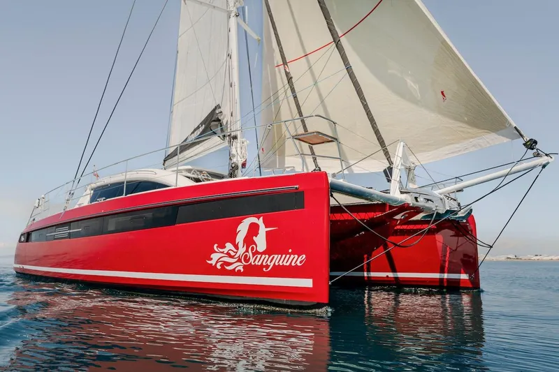 Slide: The Image of Red Privilege Signature 510 catamaran on calm water, year 2025. - 3