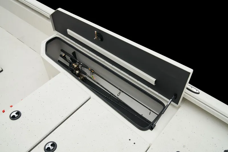 Slide: The Image of Manufacturer Provided Image: Ranger RB210 2025 boat with open rod storage compartment, showcasing fishing rods. - 29
