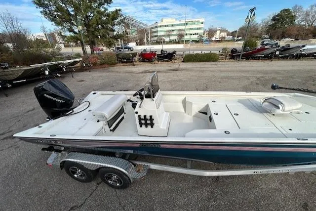Slide: The Image of 2025 Ranger RB210 boat on trailer, parked outdoors, with Mercury outboard motor. - 5