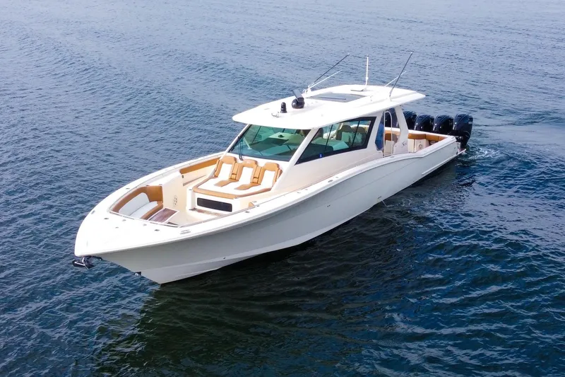 The Image of 2020 Scout 530 LXF luxury boat cruising on open water. - 0