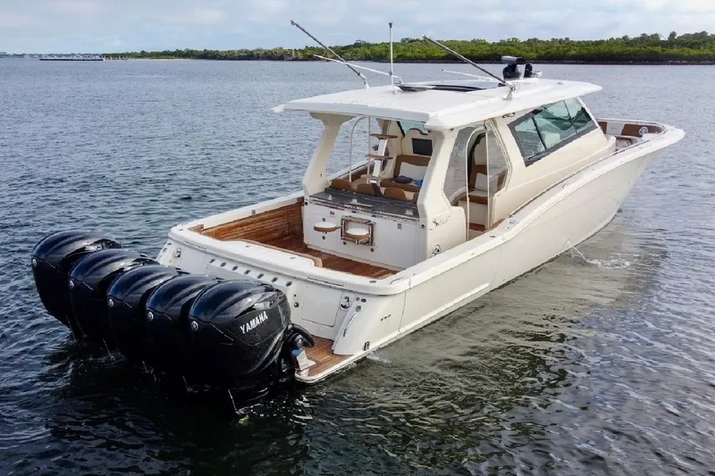 Slide: The Image of 2020 Scout 530 LXF boat with Yamaha outboard engines on open water. - 2