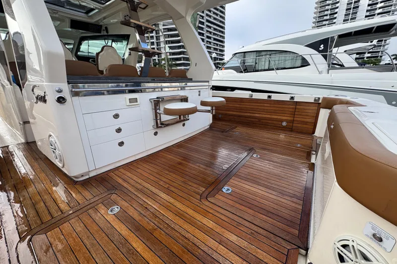 Slide: The Image of Luxurious 2020 Scout 530 LXF yacht interior with polished wood flooring and seating. - 7