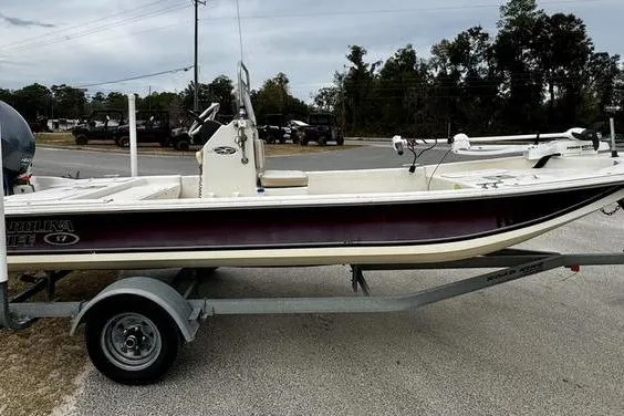 Slide: The Image of 2015 Carolina Skiff JV17CC boat on trailer, parked outdoors. - 2