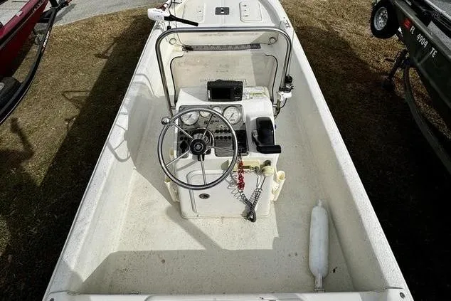 Slide: The Image of 2015 Carolina Skiff JV17CC boat interior with steering wheel and control panel. - 7