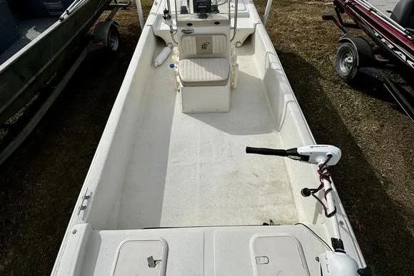 Slide: The Image of 2015 Carolina Skiff JV17CC boat interior with seating and steering console. - 8