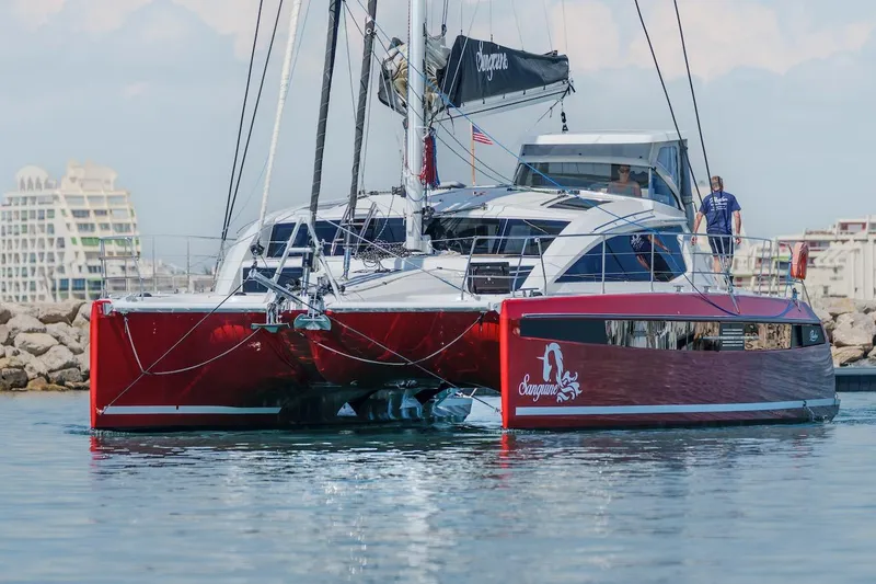 The Image of Red Privilege Signature 510 catamaran in harbor, year 2025. - 0