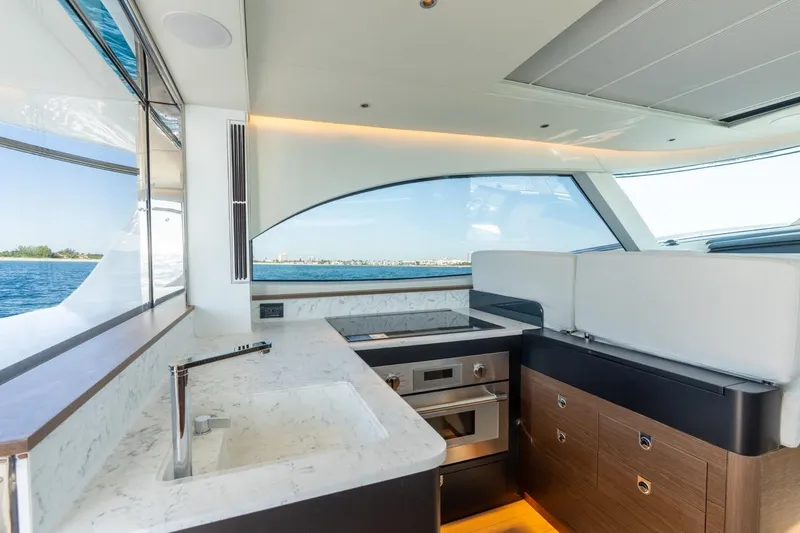Slide: The Image of Luxurious interior of 2026 ECLIPSE 505 Shadow yacht with modern kitchen and ocean view. - 12