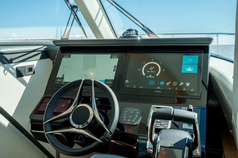 Slide: The Image of Cockpit of 2026 ECLIPSE 505 Shadow yacht with advanced navigation displays and controls. - 21