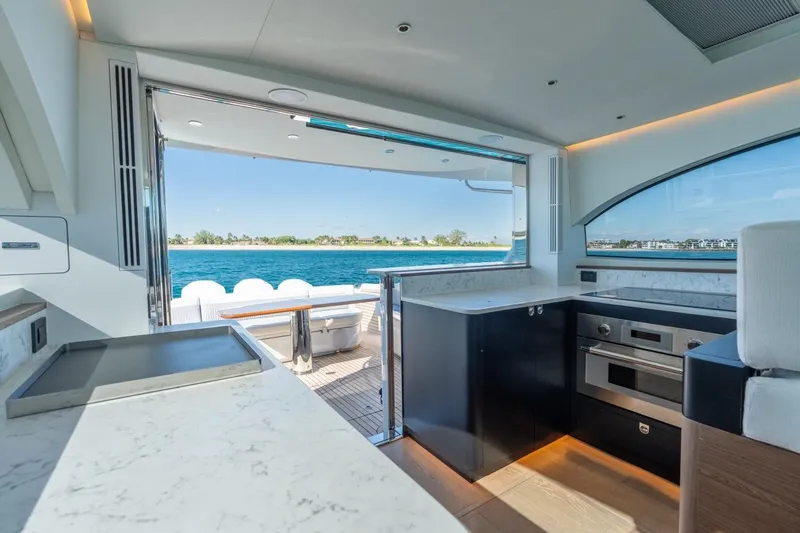 Slide: The Image of Luxurious 2026 ECLIPSE 505 Shadow yacht kitchen with ocean view and modern amenities. - 32