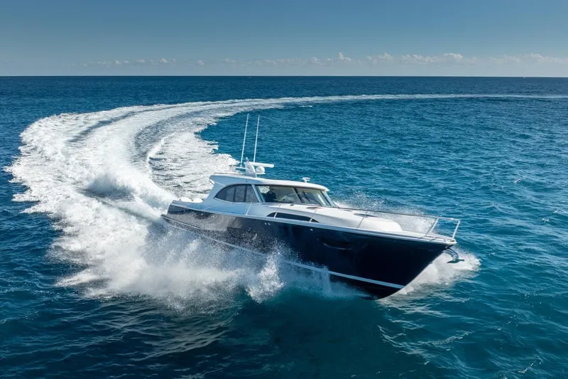 Slide: The Image of 2026 ECLIPSE 505 Shadow yacht cruising swiftly on open ocean waters. - 36