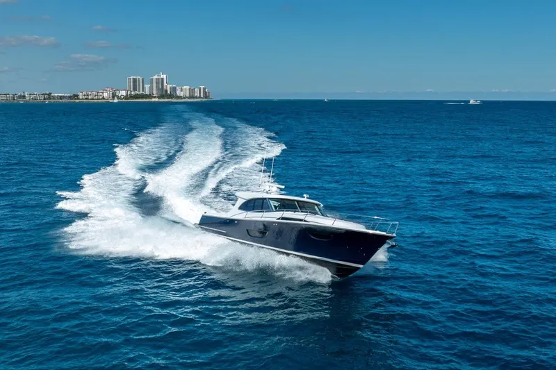 Slide: The Image of ECLIPSE 505 Shadow yacht cruising on blue ocean near city skyline, 2026 model. - 41