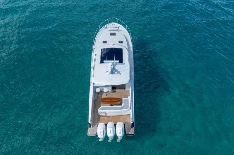 Slide: The Image of Aerial view of 2026 ECLIPSE 505 Shadow yacht on clear blue water. - 42