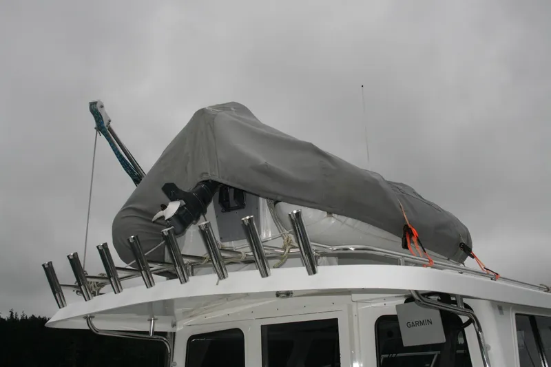 Slide: The Image of Ocean Sport Roamer 30 #117, 2019 model, docked with twin outboard engines. - 3