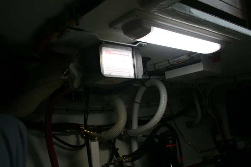 Slide: The Image of Engine room of 2019 Ocean Sport Roamer 30 #117 with wiring and equipment. - 30