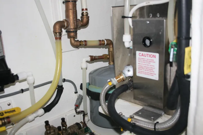 Slide: The Image of Engine room of 2019 Ocean Sport Roamer 30 #117 with illuminated equipment and wiring. - 31