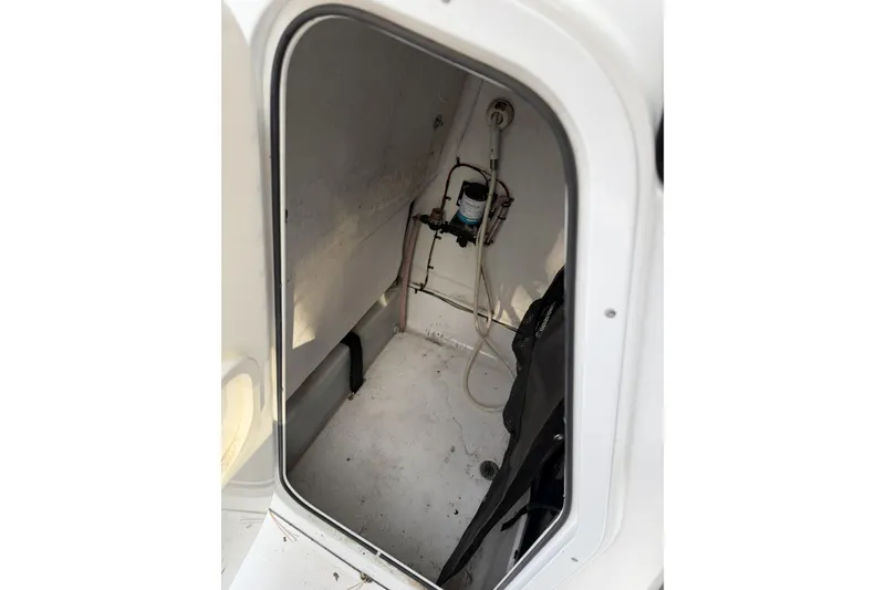 Slide: The Image of 2016 Sportsman Open 212 Center Console interior compartment view. - 12