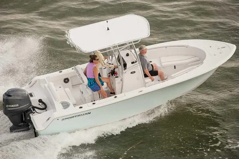 Slide: The Image of Manufacturer Provided Image: 2016 Sportsman Open 212 Center Console boat cruising on water. - 6