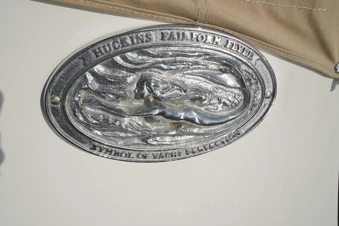 Slide: The Image of Huckins Atlantic 44 yacht emblem, 2003, featuring "Symbol of Yacht Perfection" inscription. - 11