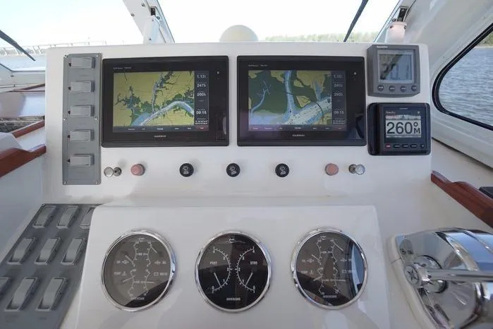 Slide: The Image of Helm of 2003 Huckins Atlantic 44 with navigation screens and gauges. - 20