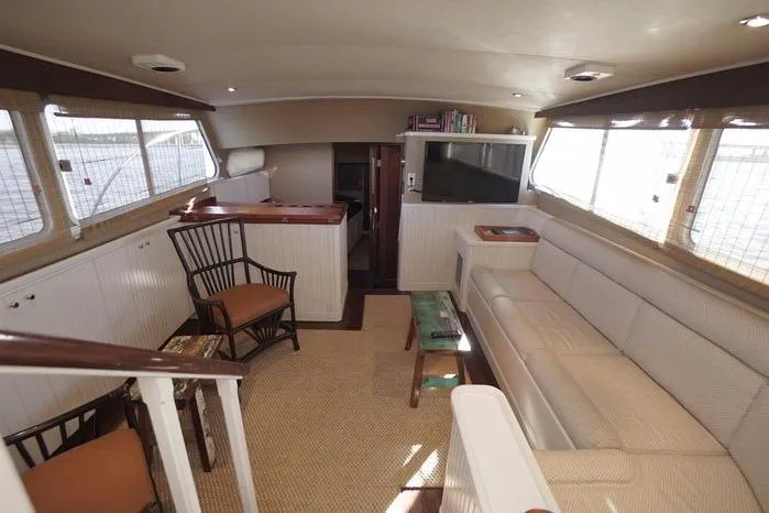 Slide: The Image of Interior of 2003 Huckins Atlantic 44 yacht with elegant seating and entertainment area. - 23